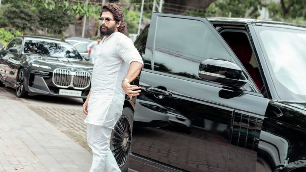 Allu Arjun leaning against a luxurious black SUV